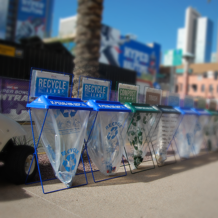 Single Stream recycling bins deployed at an outdoor festival or stadium concourse.